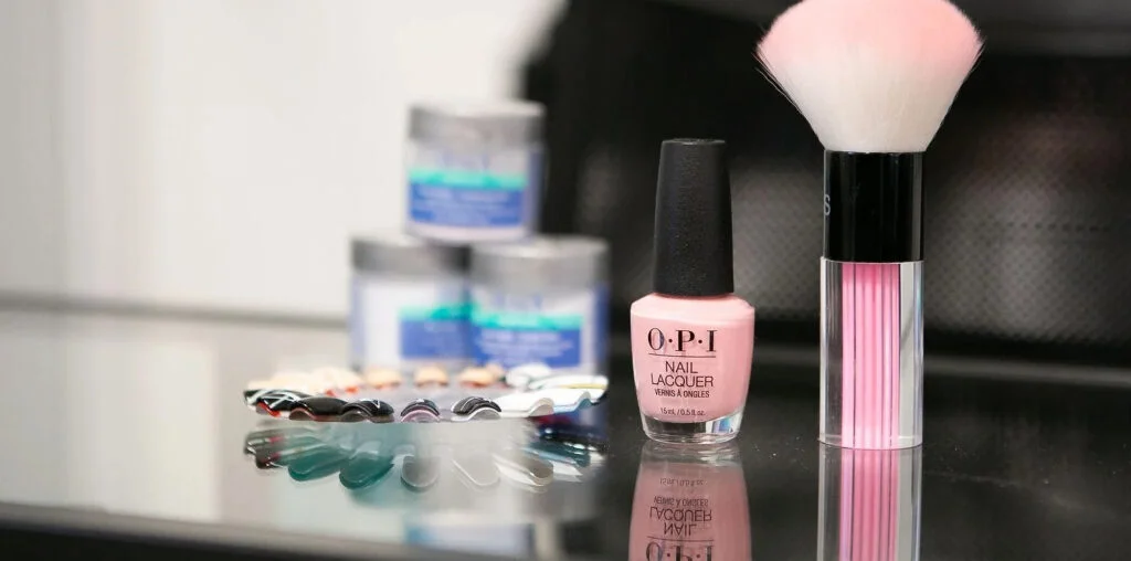 Inside the atelier — OPI lacquer, dip powders and colour swatches on the counter